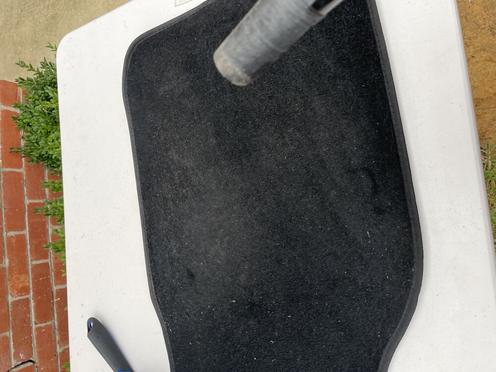 Mobile car detailing in progress, pressure washing a car in a Geelong front yard